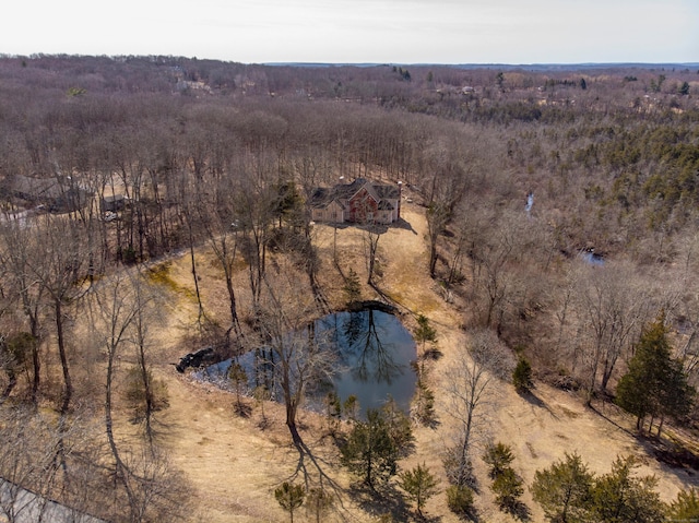 aerial view with a forest view and a water view