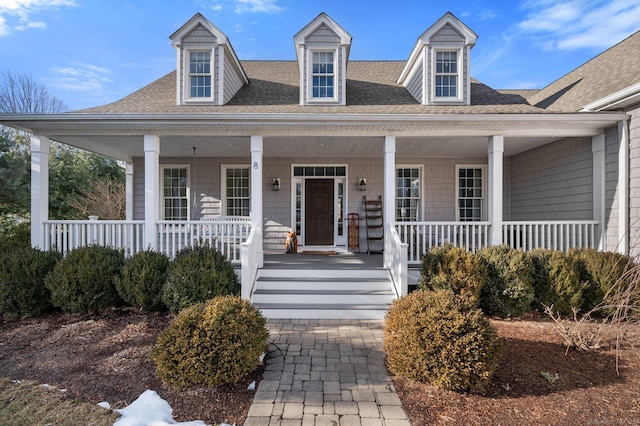 view of front facade featuring a porch and a shingled roof