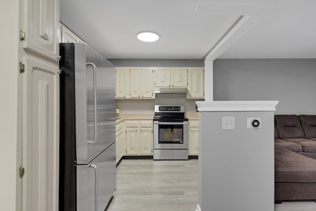 kitchen featuring light wood-style flooring, open floor plan, stainless steel appliances, light countertops, and under cabinet range hood