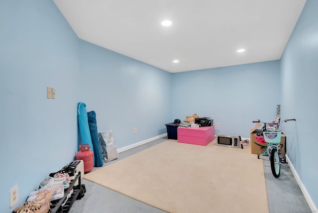 recreation room with baseboards, carpet, and recessed lighting