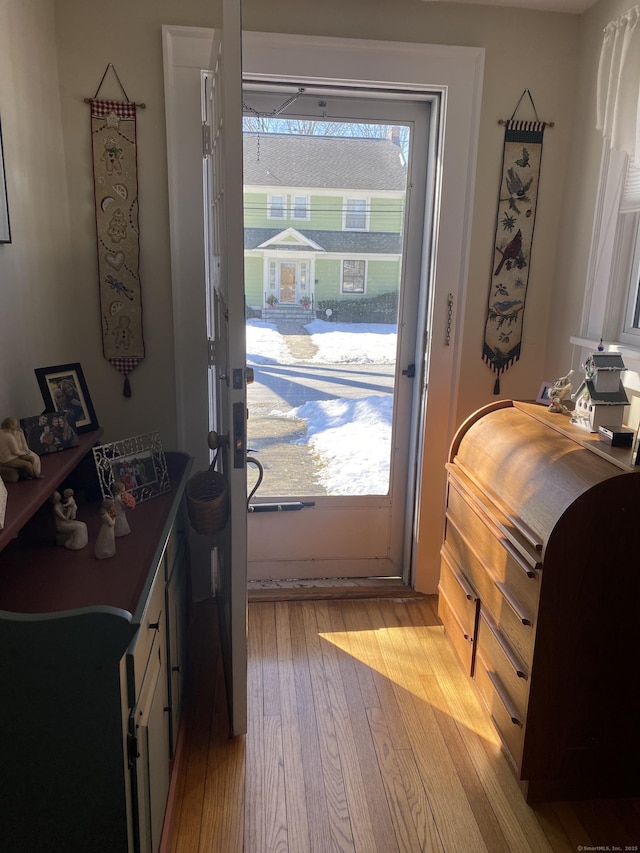 doorway featuring light wood finished floors