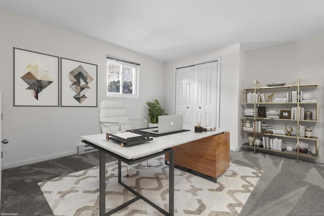 office area with baseboards and light colored carpet