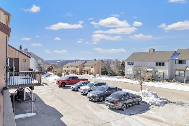 uncovered parking lot with a residential view