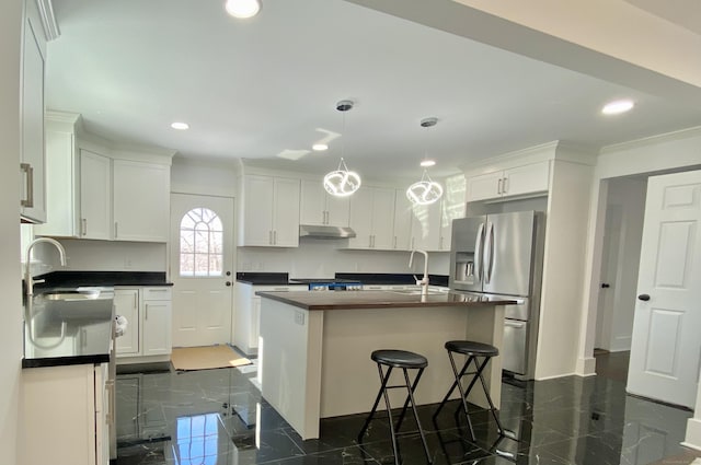 kitchen featuring recessed lighting, under cabinet range hood, stainless steel refrigerator with ice dispenser, and white cabinetry