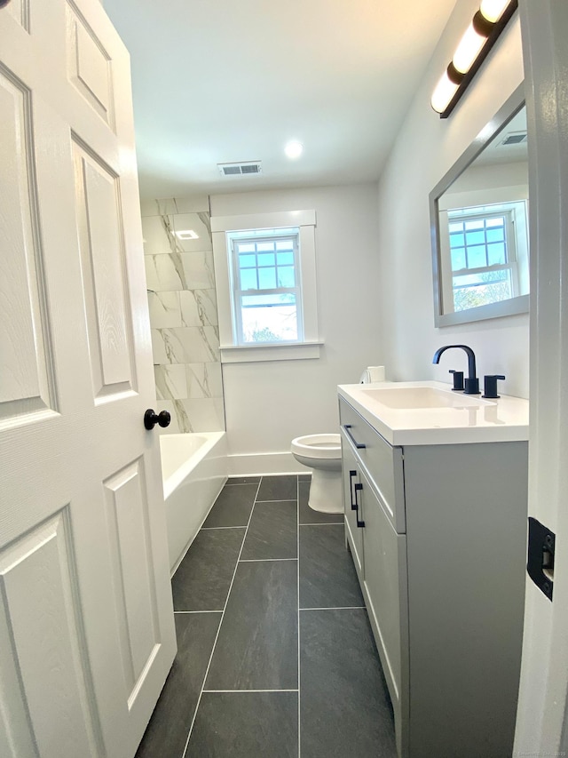 full bathroom with toilet, visible vents, a healthy amount of sunlight, and vanity