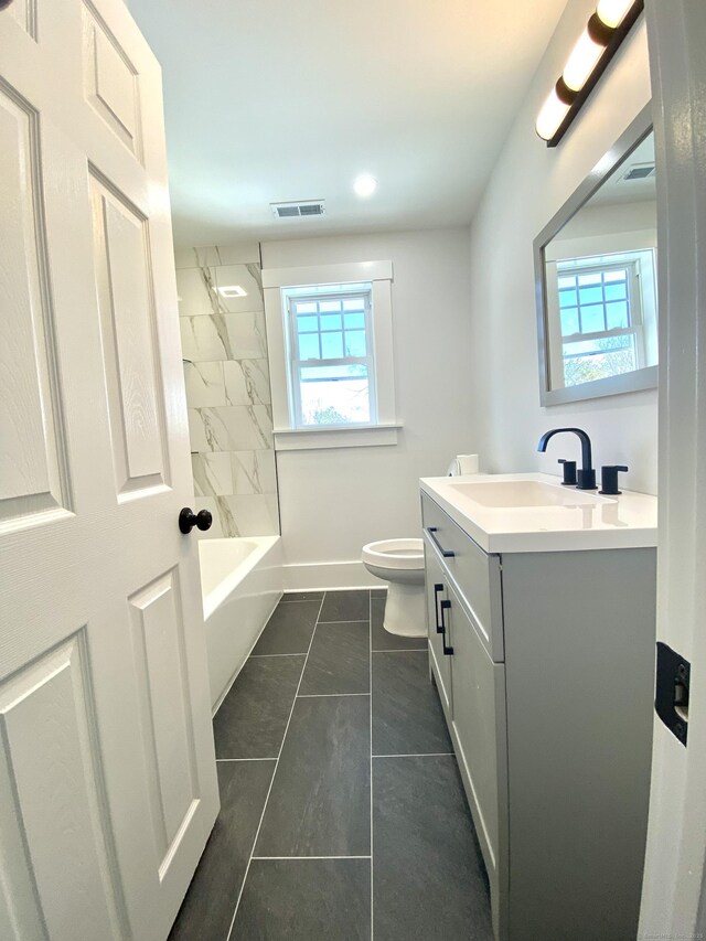 11 Charles St, Torrington, CT 06790 - bathroom with vanity, plenty of natural light, toilet, and tile patterned floors