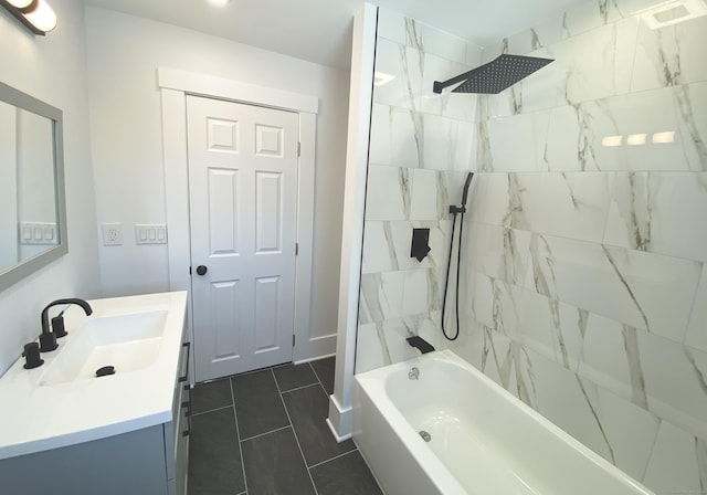 full bath featuring vanity, tile patterned flooring, and bathing tub / shower combination
