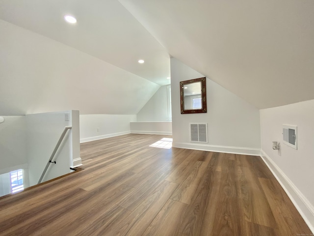bonus room featuring recessed lighting, baseboards, wood finished floors, lofted ceiling, and visible vents