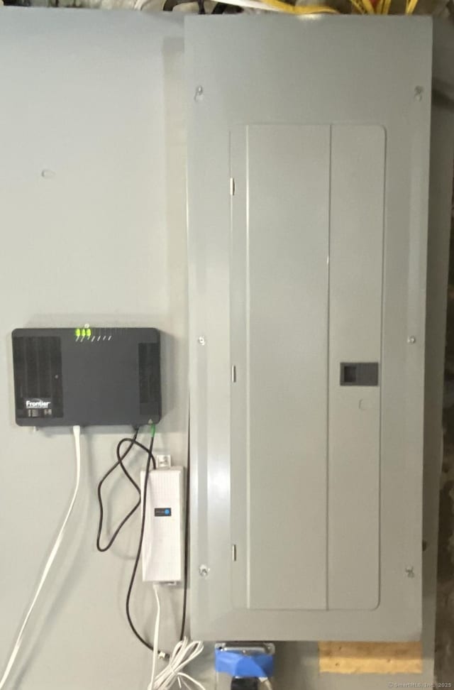 11 Charles St, Torrington, CT 06790 - utility room featuring electric panel