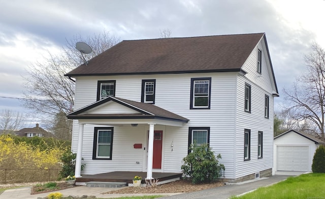 11 Charles St, Torrington, CT 06790 - view of front facade featuring covered porch, an outdoor structure, a shingled roof, and a detached garage