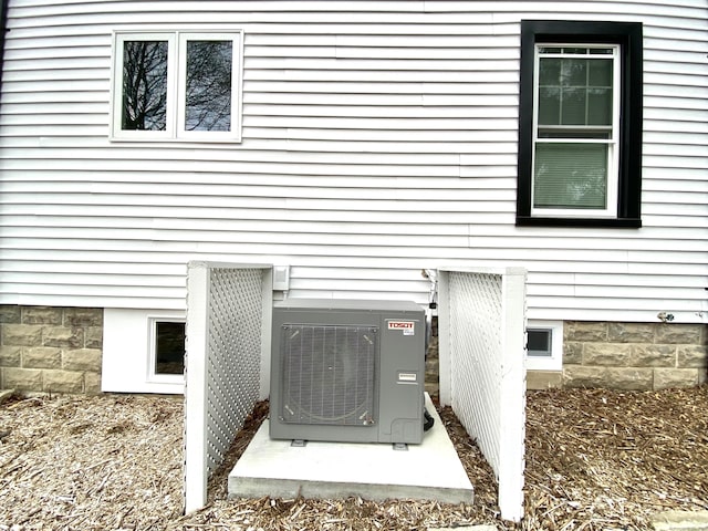 exterior details featuring ac unit