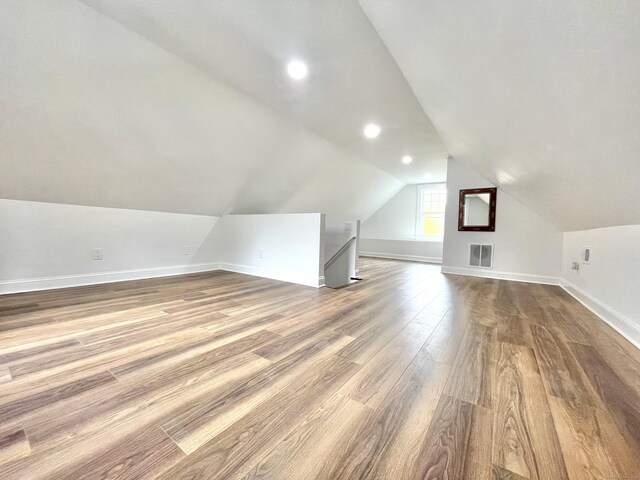 11 Charles St, Torrington, CT 06790 - bonus room with dark wood-type flooring, lofted ceiling, baseboards, and recessed lighting