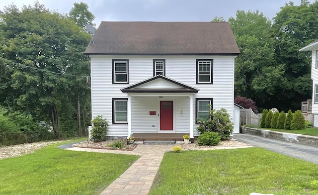 11 Charles St, Torrington, CT 06790 - view of front of home featuring covered porch and a front yard