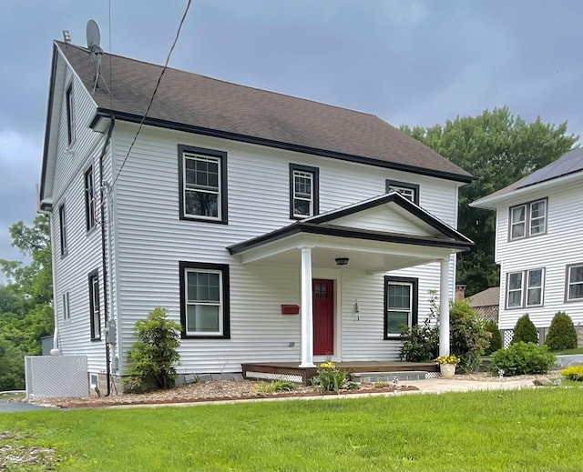 11 Charles St, Torrington, CT 06790 - view of front of home featuring covered porch, a front lawn, cooling unit, and a shingled roof
