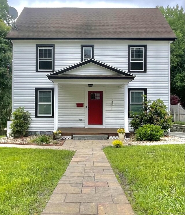 11 Charles St, Torrington, CT 06790 - view of front of house featuring covered porch, a front lawn, and roof with shingles