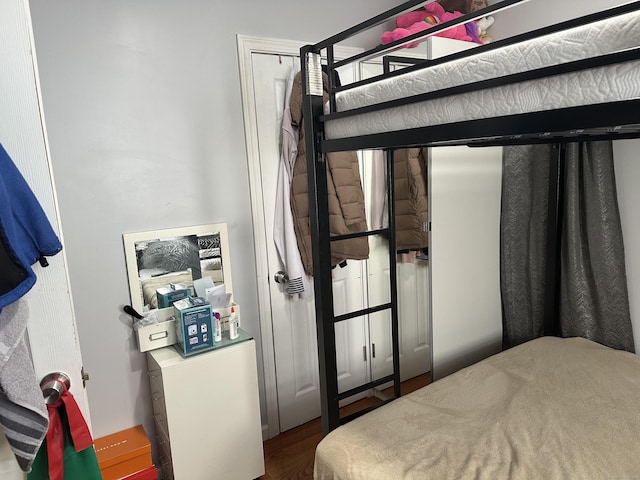 bedroom with wood finished floors