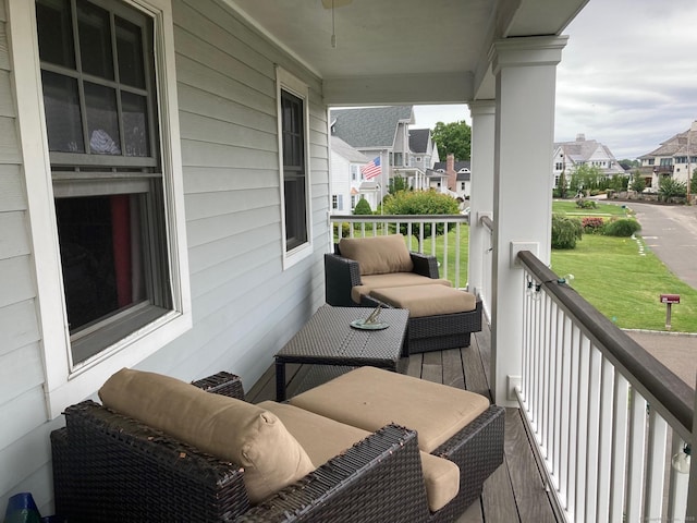 balcony featuring covered porch and a residential view