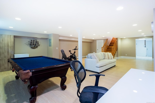 game room featuring recessed lighting, electric panel, light wood-style flooring, and baseboards