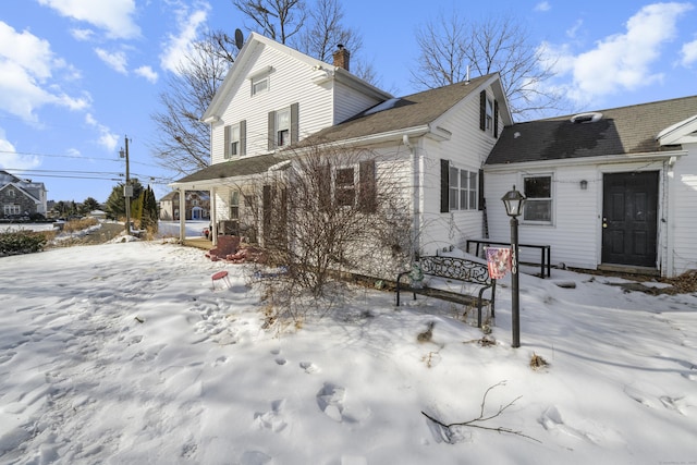 view of front of property with roof with shingles