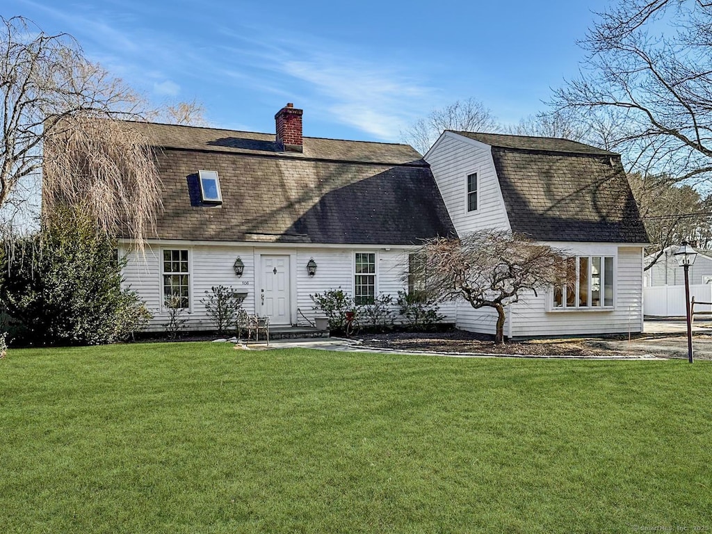 106 Shadow Ridge Rd, Stamford, CT 06905 - rear view of house featuring a shingled roof, a lawn, a chimney, and a gambrel roof