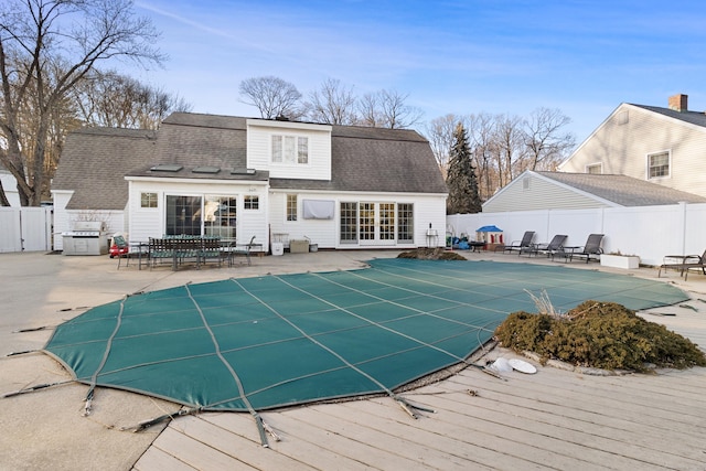 view of swimming pool featuring a fenced in pool, a patio area, and a fenced backyard