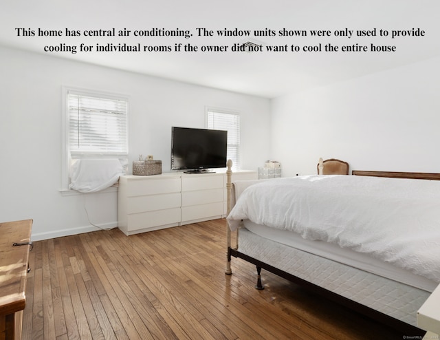 bedroom featuring light wood-type flooring and baseboards