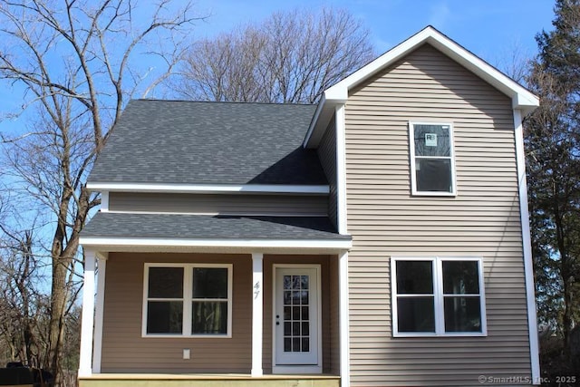 traditional-style house with a shingled roof