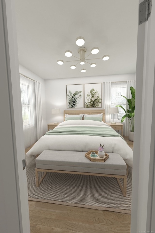 bedroom featuring recessed lighting and wood finished floors