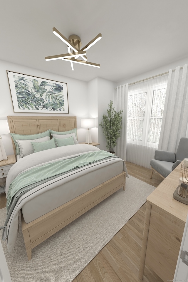 bedroom with a ceiling fan and wood finished floors
