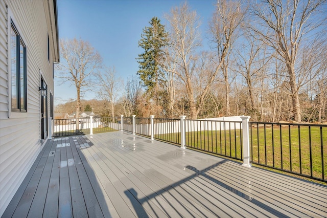 wooden terrace with a yard