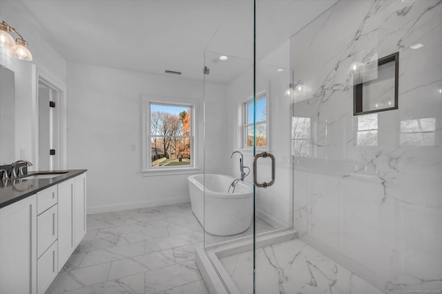 bathroom with marble finish floor, a marble finish shower, a soaking tub, visible vents, and vanity