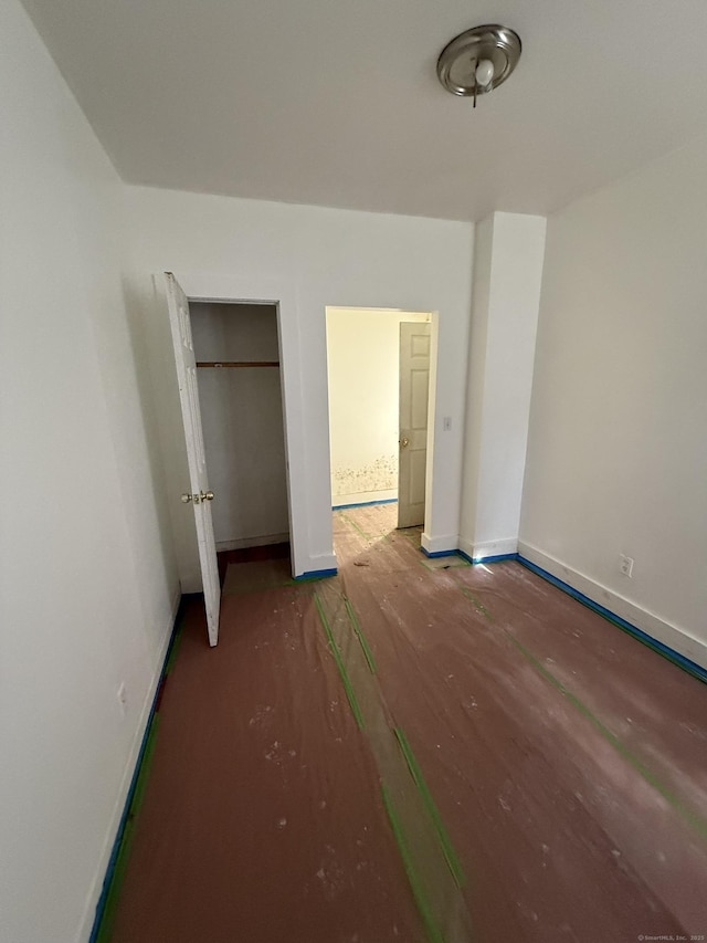 unfurnished bedroom with baseboards