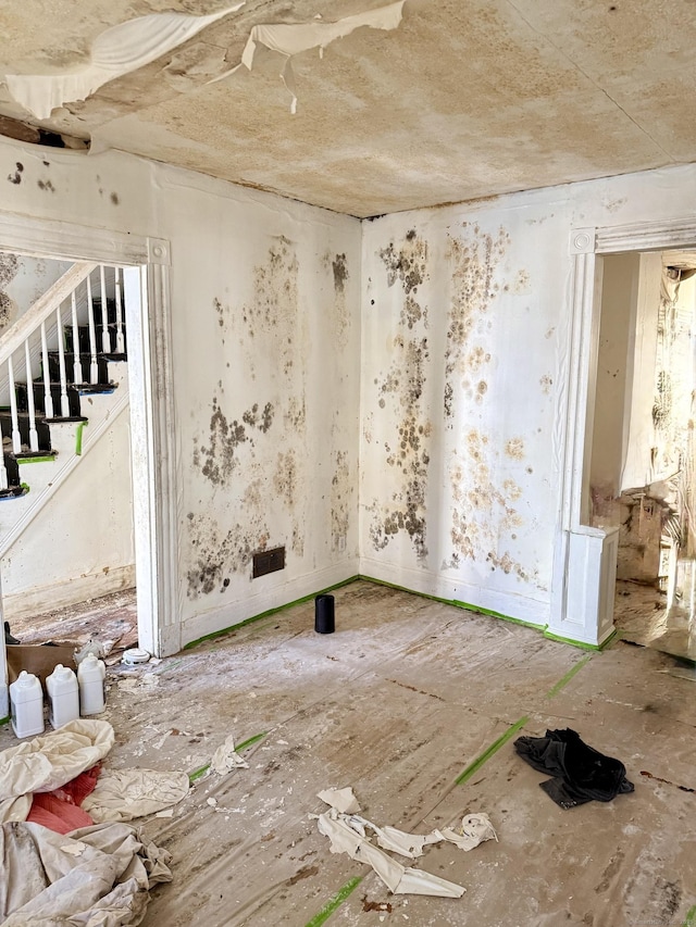 empty room featuring stairway