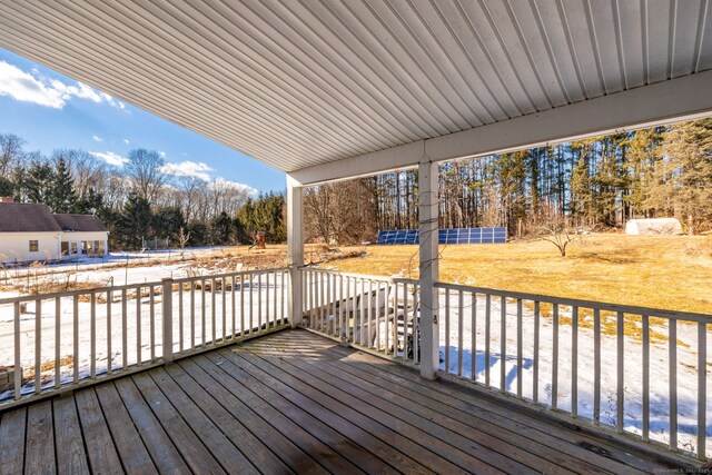 wooden terrace with a yard