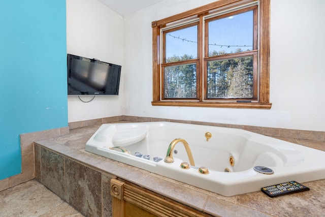 full bathroom with a whirlpool tub