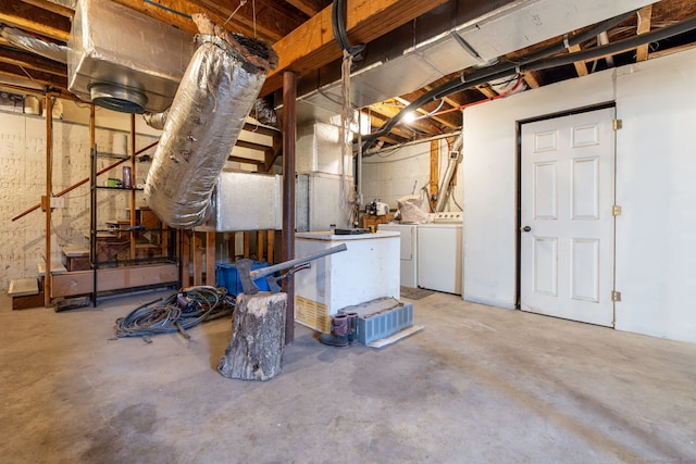 unfinished below grade area featuring washer and dryer