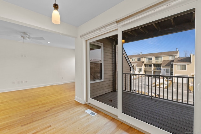 balcony featuring ceiling fan and visible vents