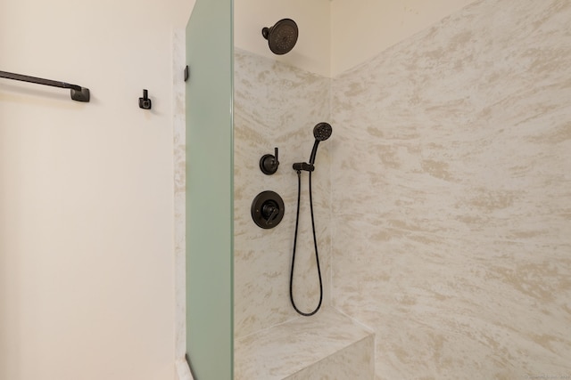 interior details with a tile shower