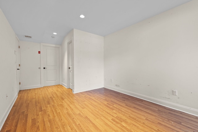 unfurnished room featuring baseboards, recessed lighting, visible vents, and light wood-style floors