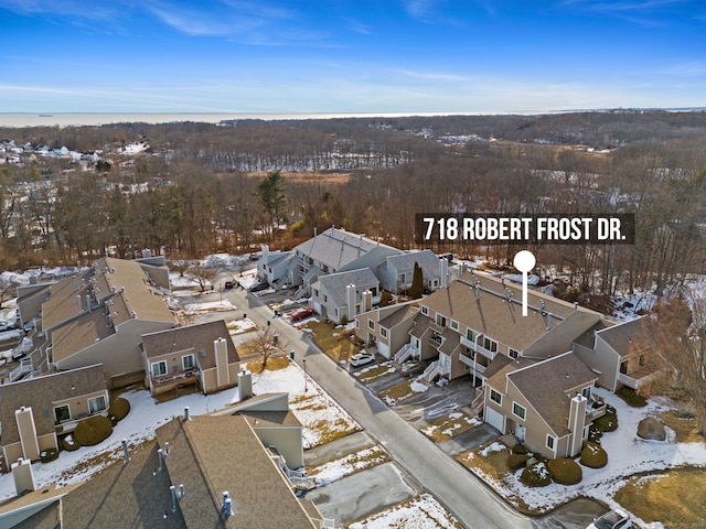 snowy aerial view featuring a residential view