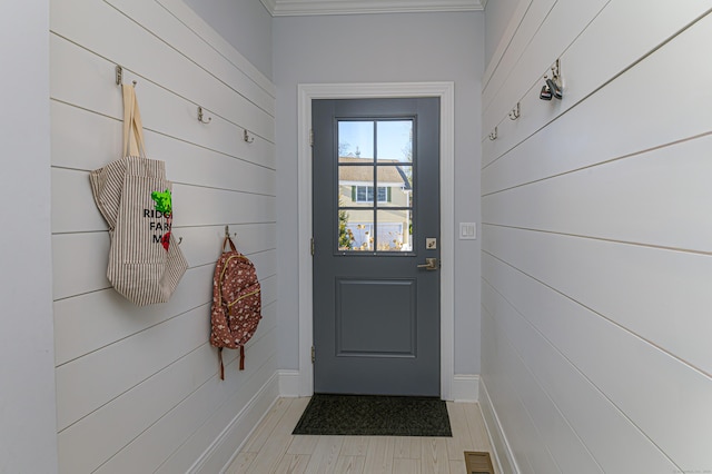 doorway to outside with light wood-type flooring and visible vents