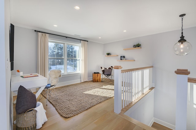 office space with light wood-style floors, recessed lighting, and baseboards