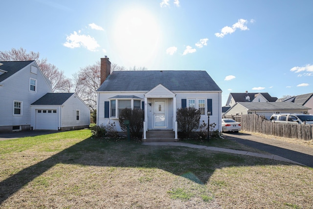 bungalow featuring a garage, fence, a front lawn, a chimney, and driveway