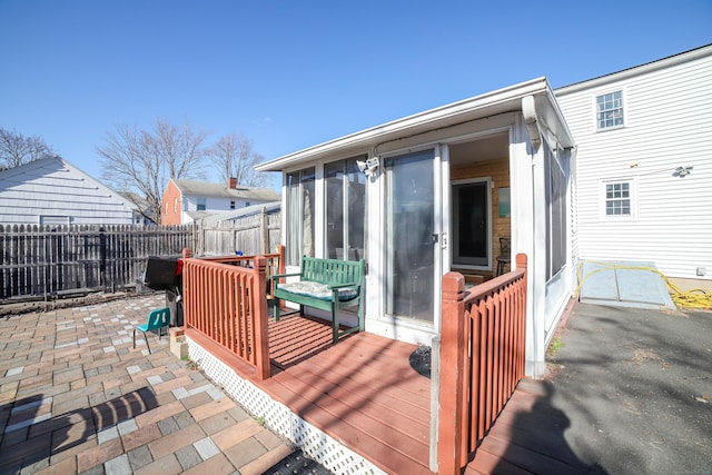 wooden deck featuring a fenced backyard