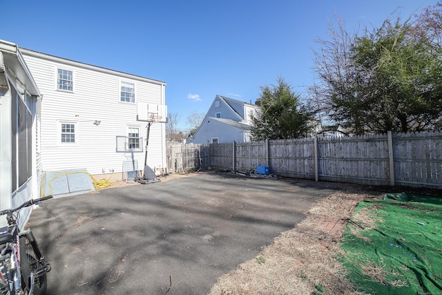 back of property with a patio area and a fenced backyard
