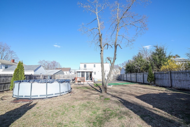 view of yard featuring a fenced backyard and a fenced in pool