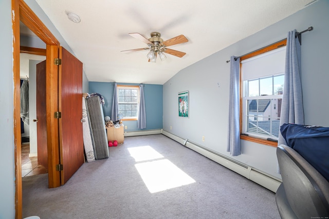 bedroom featuring a ceiling fan, a baseboard radiator, lofted ceiling, and carpet