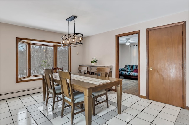 dining area with light tile patterned floors, baseboard heating, and a notable chandelier