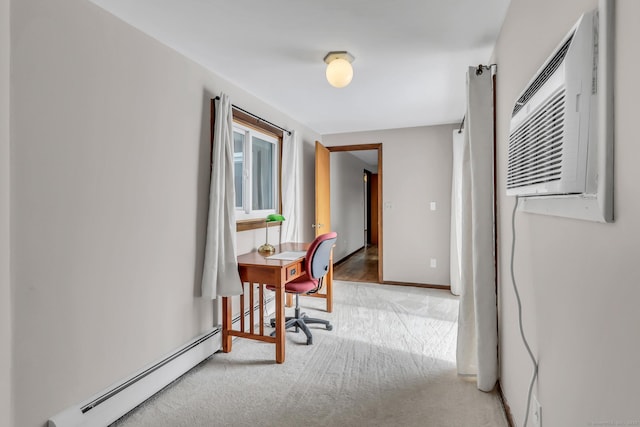 carpeted office space featuring a baseboard heating unit, an AC wall unit, and baseboards