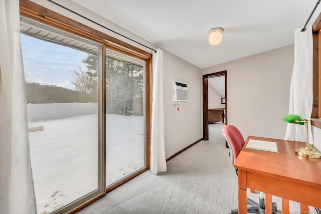 home office featuring light colored carpet, a wall unit AC, and baseboards